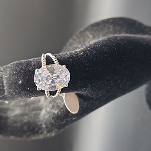 D-5 Silvertone ring with clear solitaire